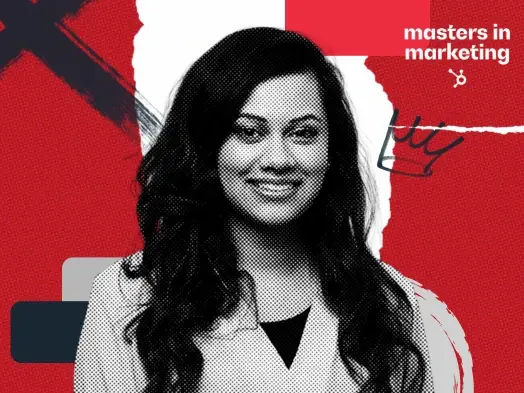 Deesha Laxsav, a smiling woman with long dark hair