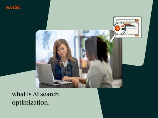 Two women at laptop researching what is AI search optimization